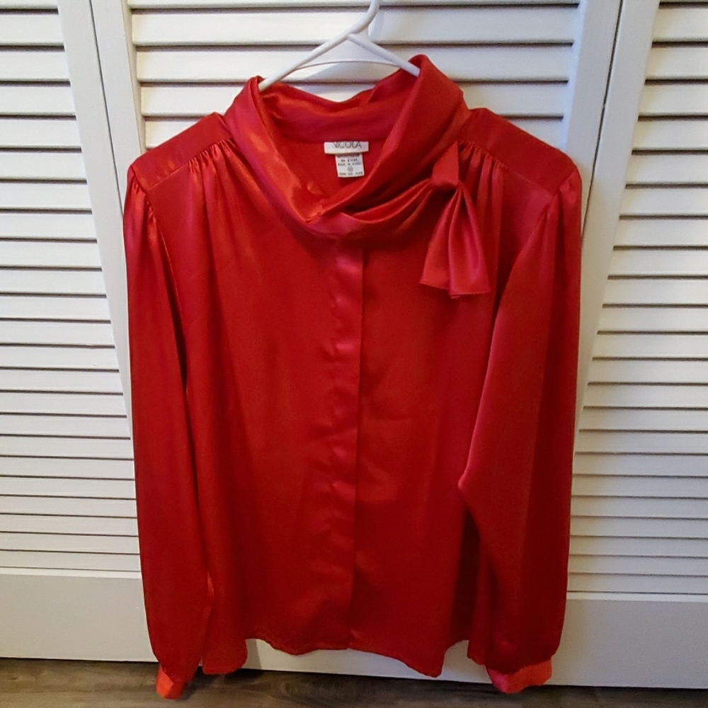 Nicola red shirt